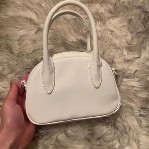 Mini white URBAN OUTFITTERS gloss purse.